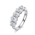 Bee-Bees sterling silver eternity ring with five 4x6mm D Color VVS1 oval cut moissanite stones.