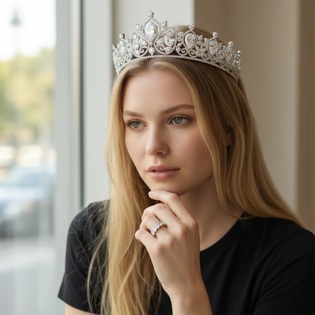 Bee-Bees 0.5ct oval moissanite eternity ring in 18k white gold plated silver worn by a woman wearing a crystal tiara.
