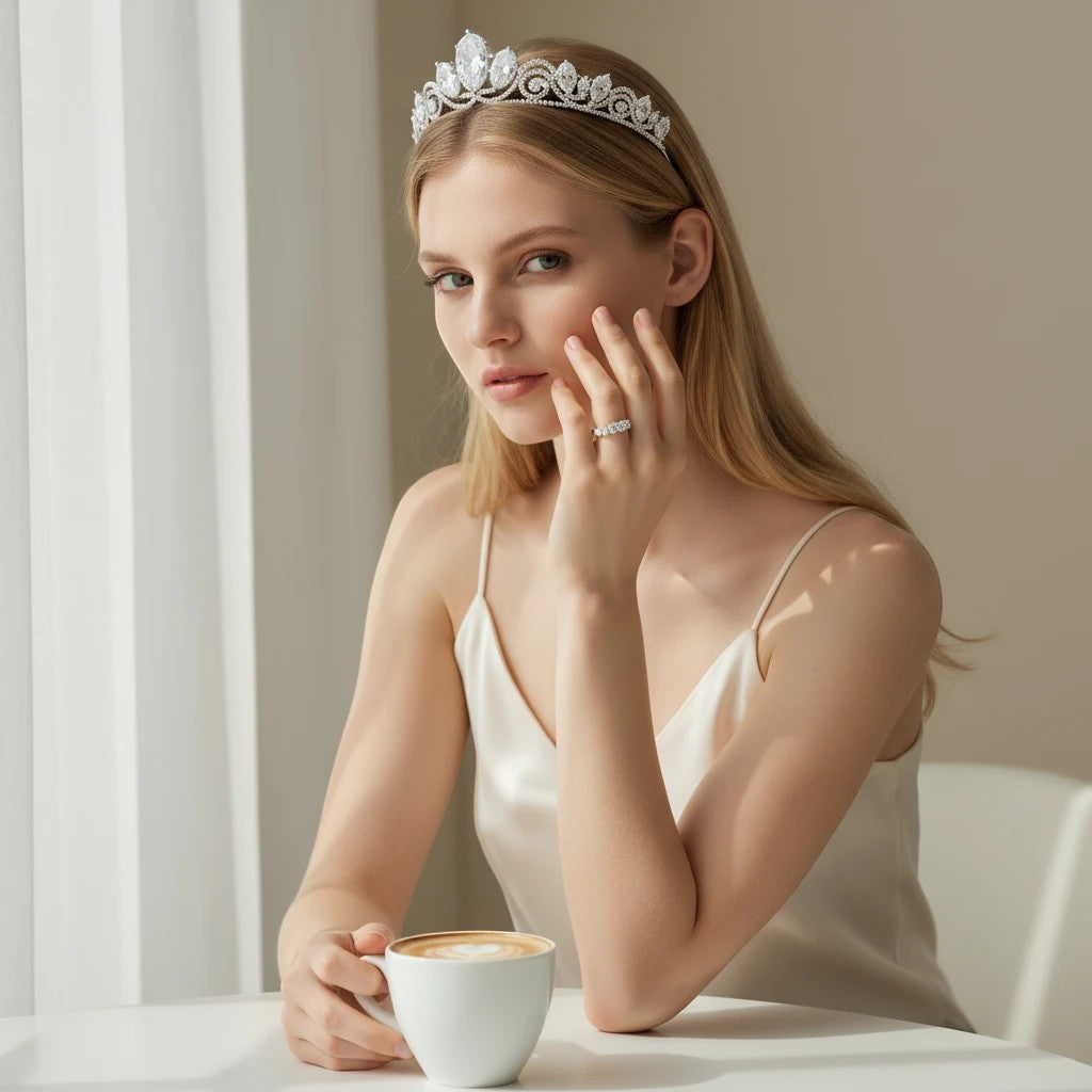 Bee-Bees 0.5ct oval moissanite eternity ring in 18k white gold plated silver worn by a woman with a matching tiara