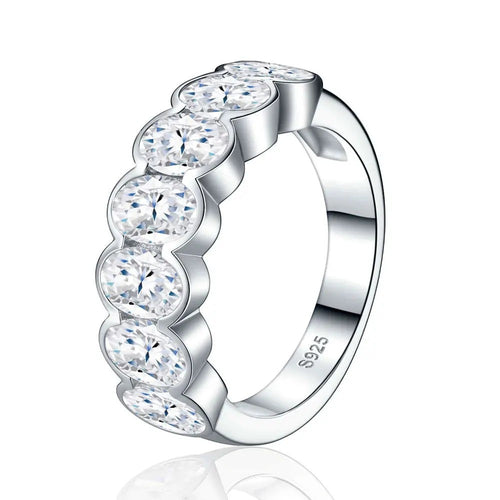 Bee-Bees 0.5ct oval-cut moissanite eternity ring in 18k white gold plated sterling silver with shared-prong setting.