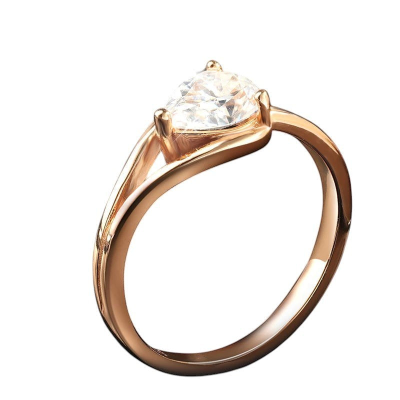 Bee-Bees 1ct pear cut moissanite engagement ring in rose gold plated sterling silver with GRA certification.