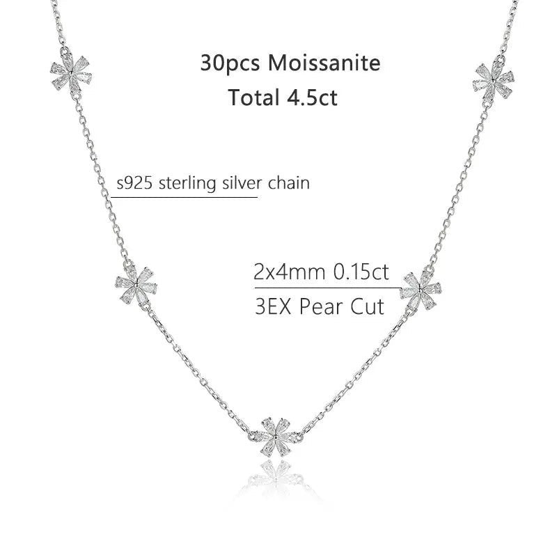 Bee-Bee's Sterling silver chain necklace with multiple small flower-shaped moissanite pendants, 2.35ct pear cut center stone.