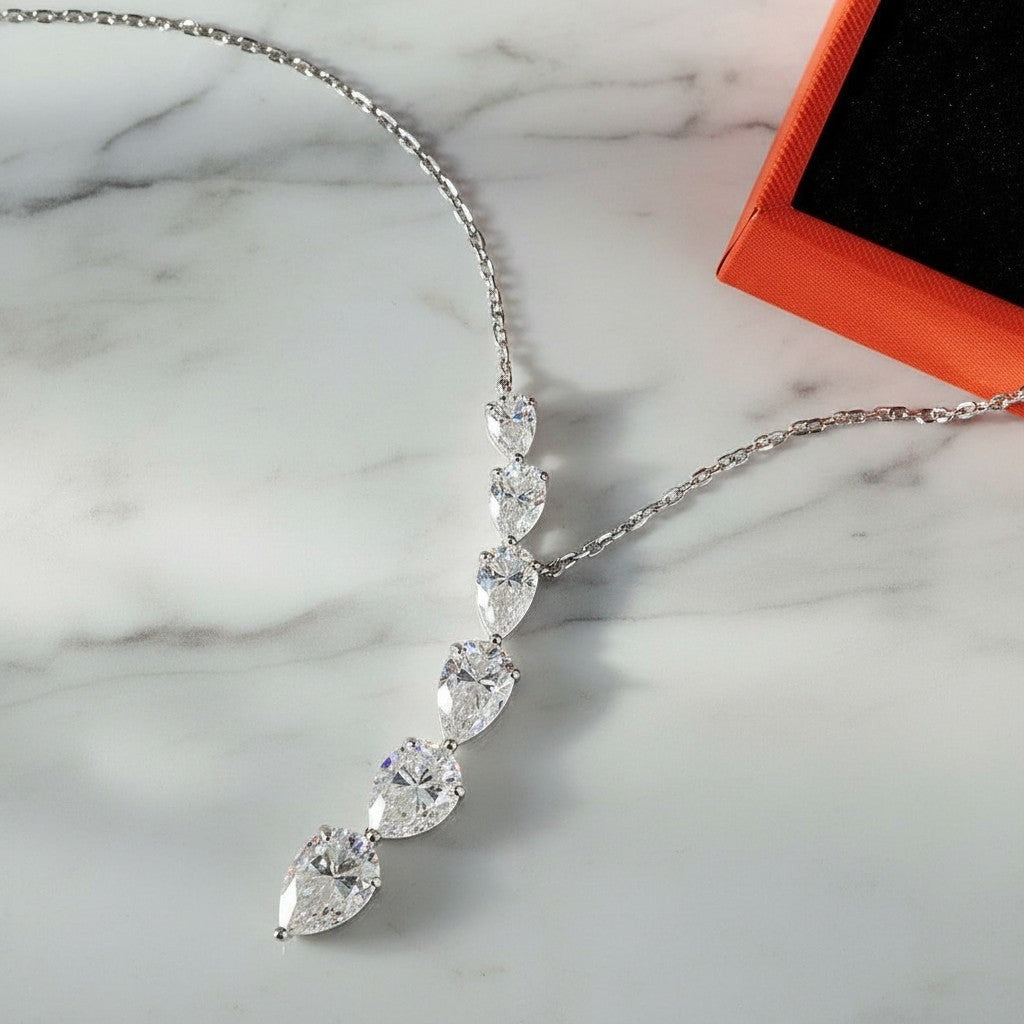 Bee-Bee's 7.6ct pear cut moissanite necklace with D color, VVS1 clarity, 18k gold plated sterling silver.