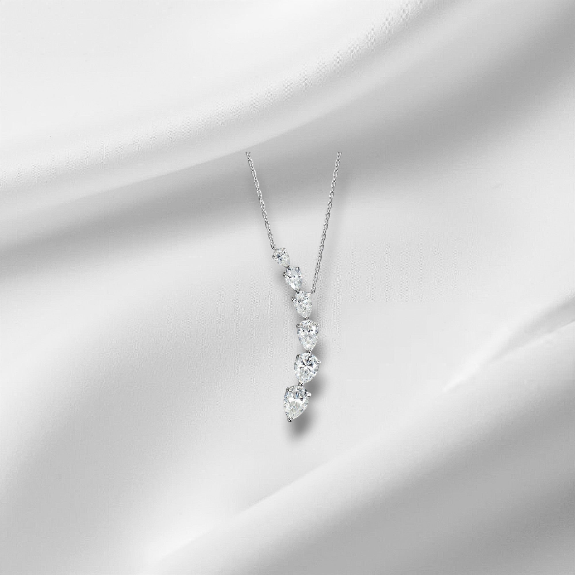 Bee-Bee's 7.6ct pear cut moissanite necklace with D color and VVS1 clarity, set in 18k gold plated sterling silver.