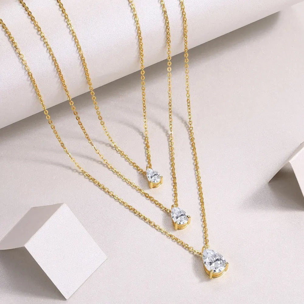Bee-Bees gold-plated sterling silver layered necklace with three pear-cut moissanite pendants.