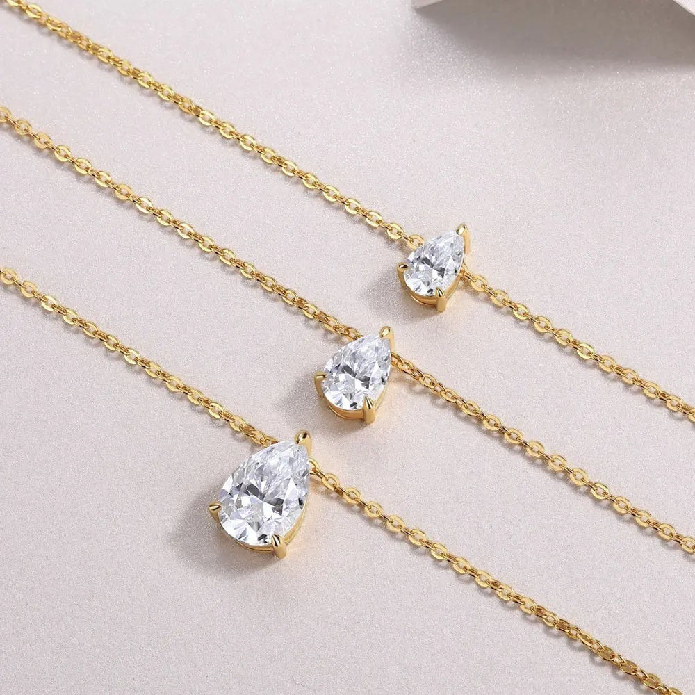 Bee-Bee's 1-5ct pear cut moissanite necklace in 18k gold plated sterling silver with D color and VVS1 clarity.