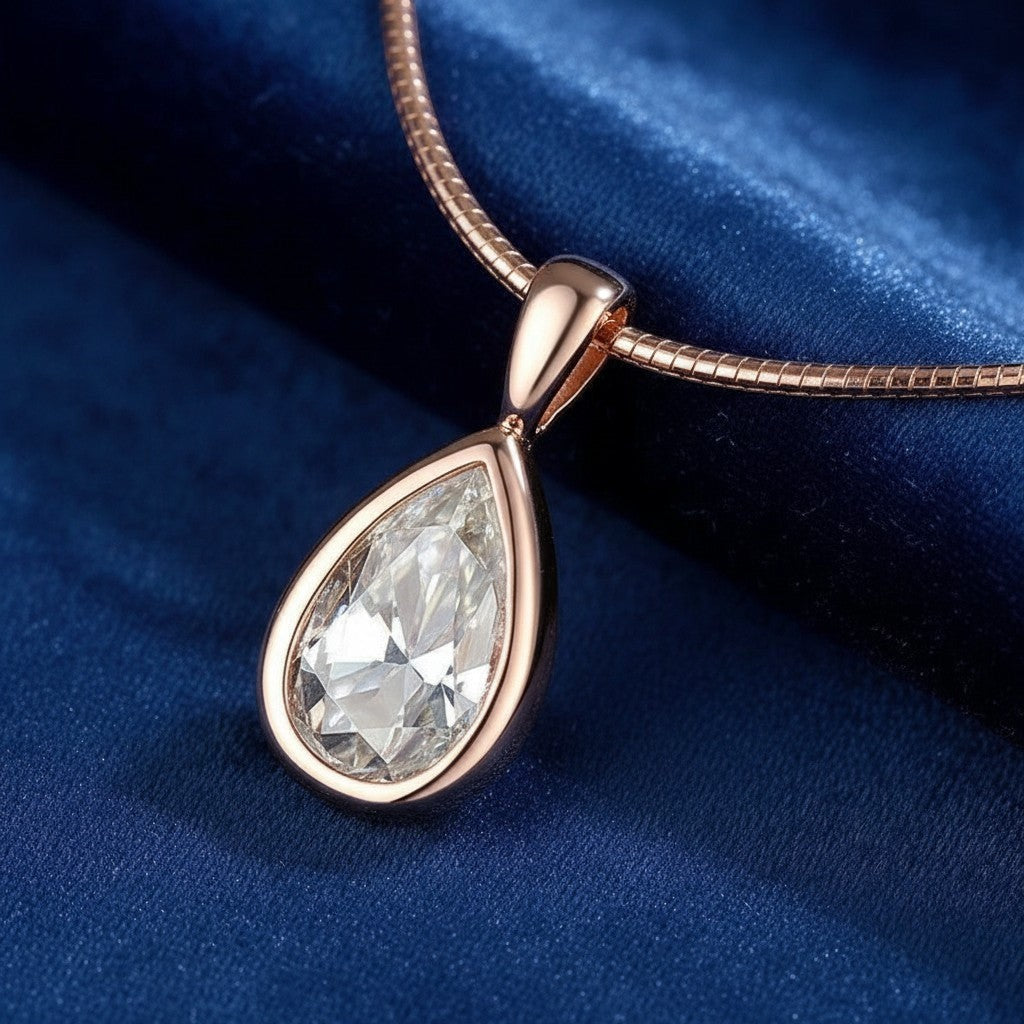 Bee-Bee's 3ct pear cut moissanite pendant necklace in rose gold plated sterling silver with D color and VVS1 clarity.