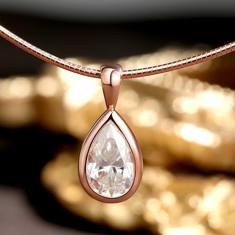 Bee-Bee's 3ct pear cut moissanite pendant necklace in rose gold plated sterling silver with D color and VVS1 clarity.