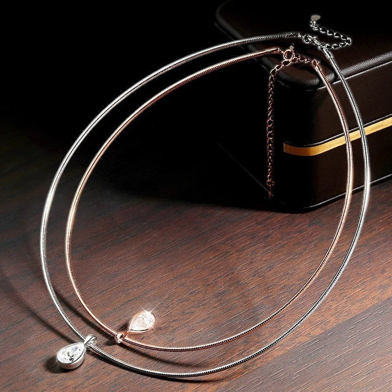 Bee-Bee's 3ct pear cut moissanite necklace in sterling silver with rose gold plating and a teardrop pendant.