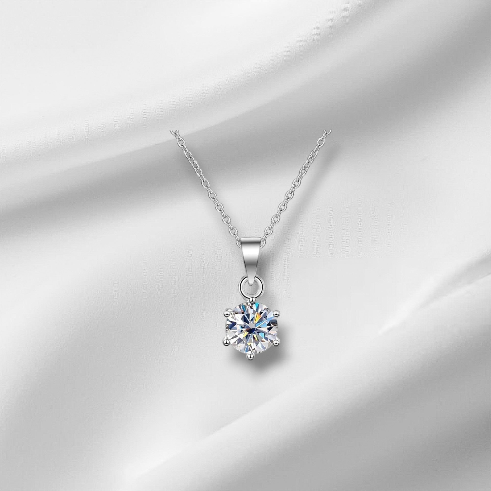 Bee-Bee's classic pear cut moissanite necklace in S925 sterling silver with a 6-prong setting and adjustable chain.