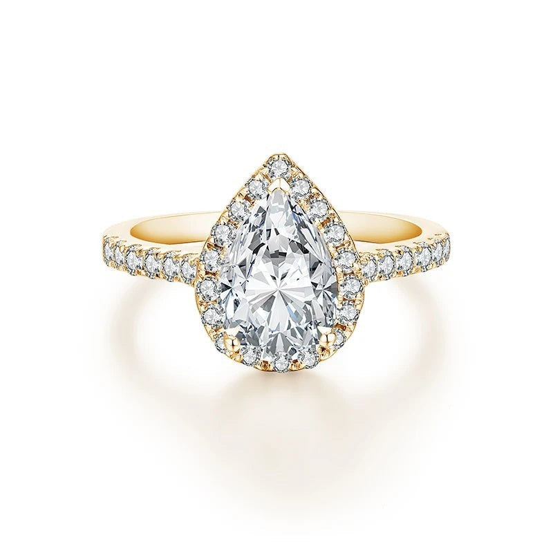 Bee-Bees 2.0CT pear cut moissanite engagement ring with a gold-plated 925 sterling silver band and halo setting.
