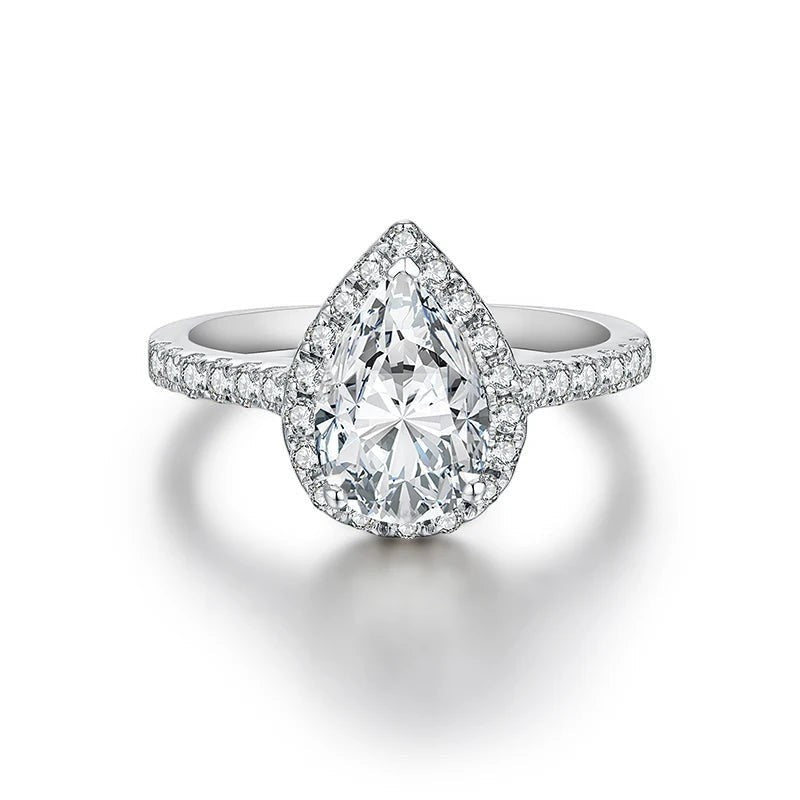 Bee-Bees 2.0ct pear cut moissanite engagement ring with a halo setting on a 925 sterling silver band.
