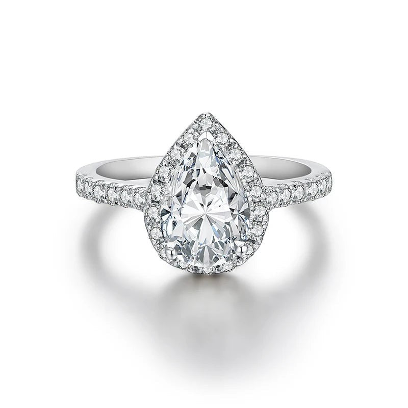 Bee-Bees 2.0ct pear cut moissanite engagement ring with a halo setting on a 925 sterling silver band.