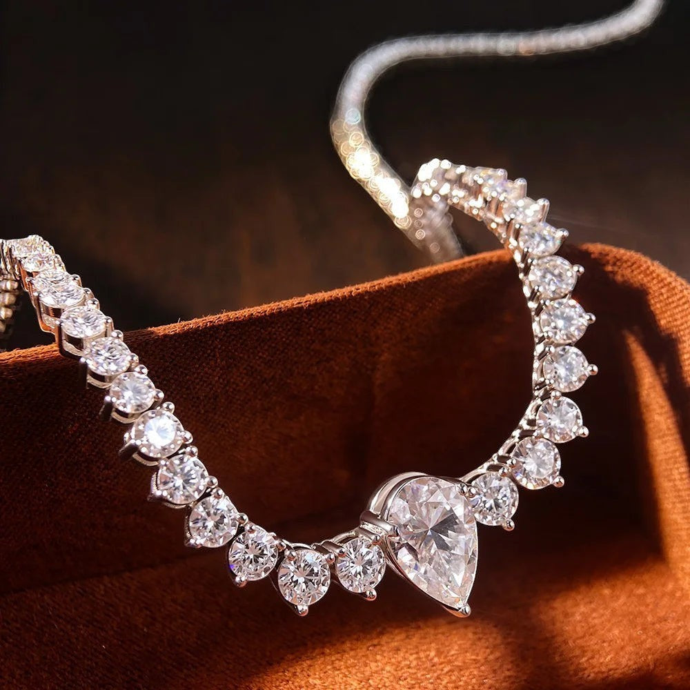 Bee-Bee's 4ct pear cut moissanite tennis necklace with VVS1 D color stones in sterling silver with 18K gold plating.