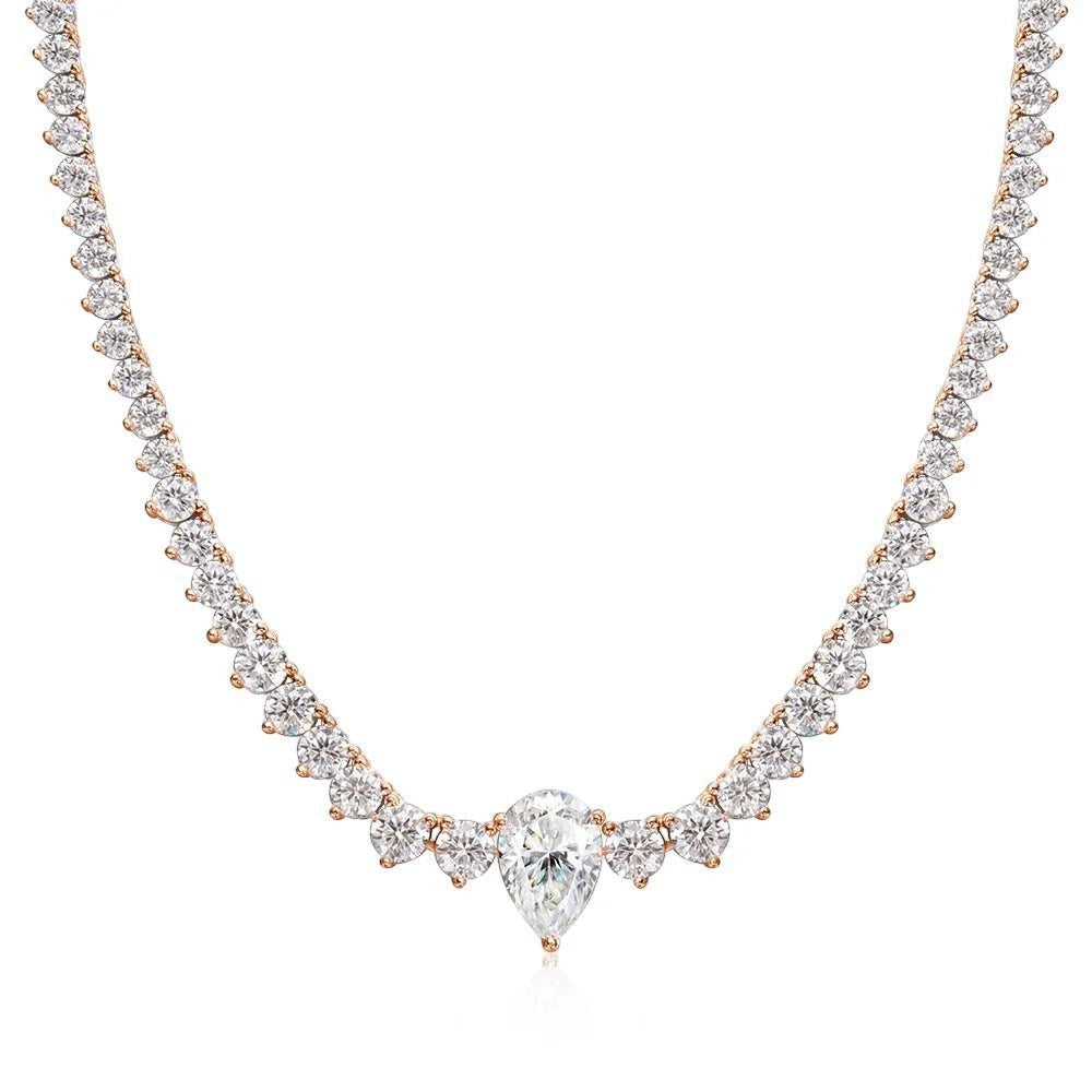 Bee-Bee's rose gold plated sterling silver tennis necklace with 4ct pear cut moissanite center stone and round cut stones.