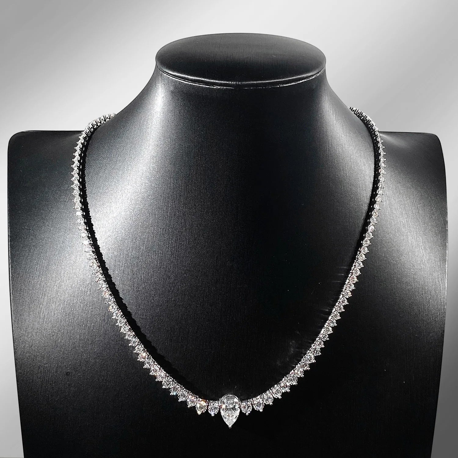 Bee-Bees 4ct pear cut moissanite tennis necklace with VVS1 D color stones set in 18K gold plated sterling silver.