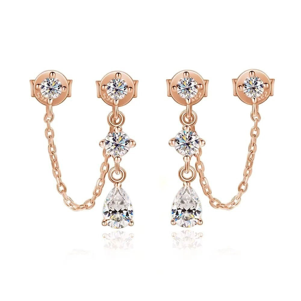 Bee-Bee's rose gold sterling silver drop earrings with pear-cut moissanite stones and chain detail.