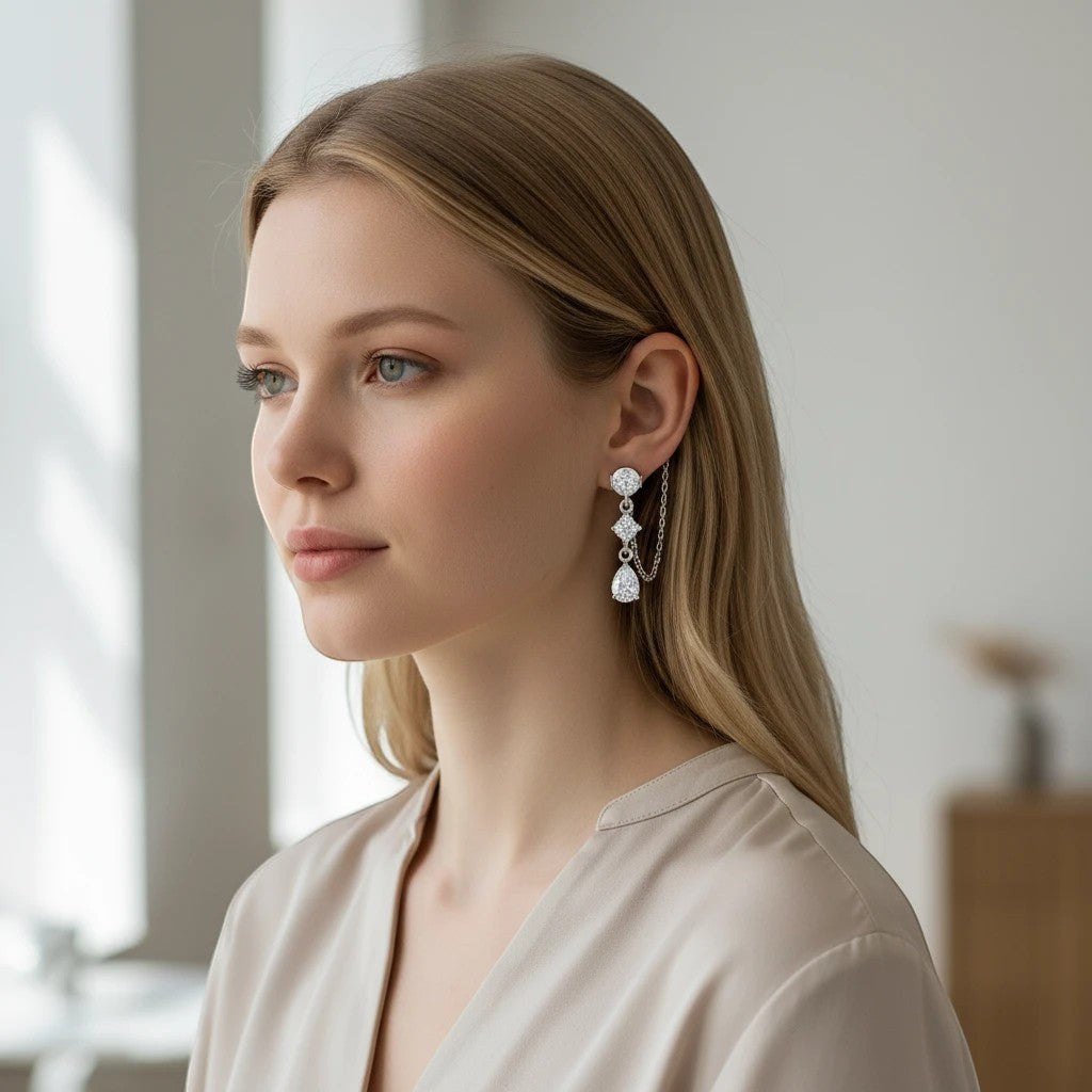 Bee-Bee's D VVS1 pear cut moissanite drop earrings in solid S925 sterling silver with 18k gold plating.