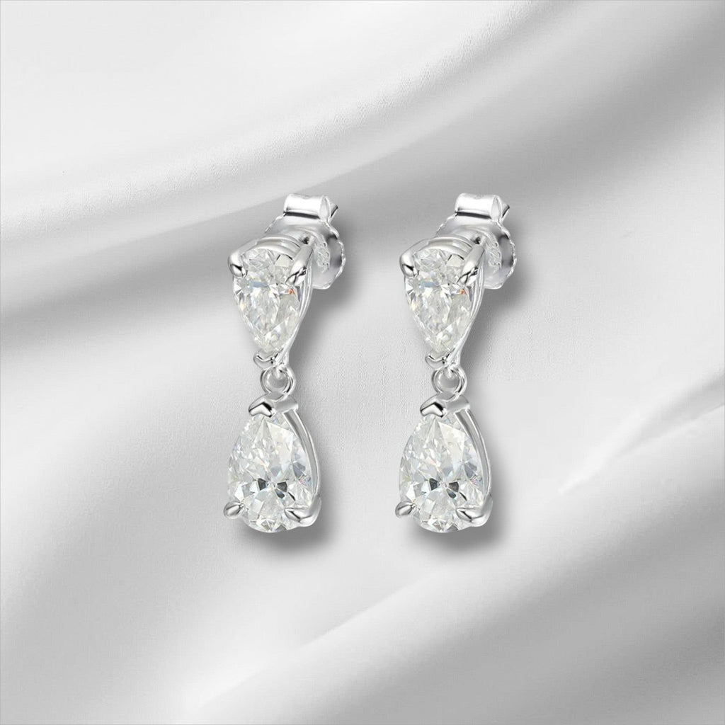 Bee-Bee's D VVS1 pear cut moissanite drop earrings in solid S925 sterling silver with 18k gold plating.