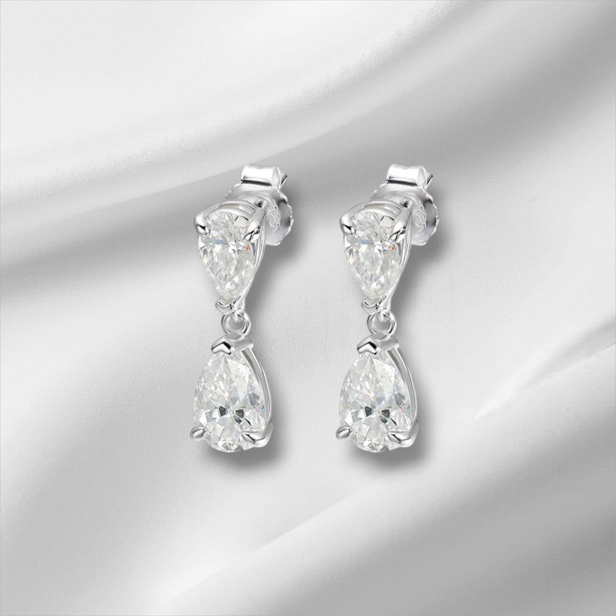 Bee-Bee's D VVS1 pear cut moissanite drop earrings in solid S925 sterling silver with 18k gold plating.