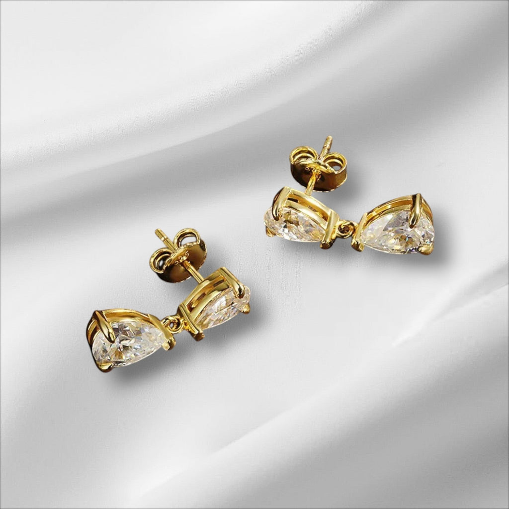 Bee-Bees D VVS1 pear cut moissanite drop earrings in 18k gold plated sterling silver with secure stud backing.