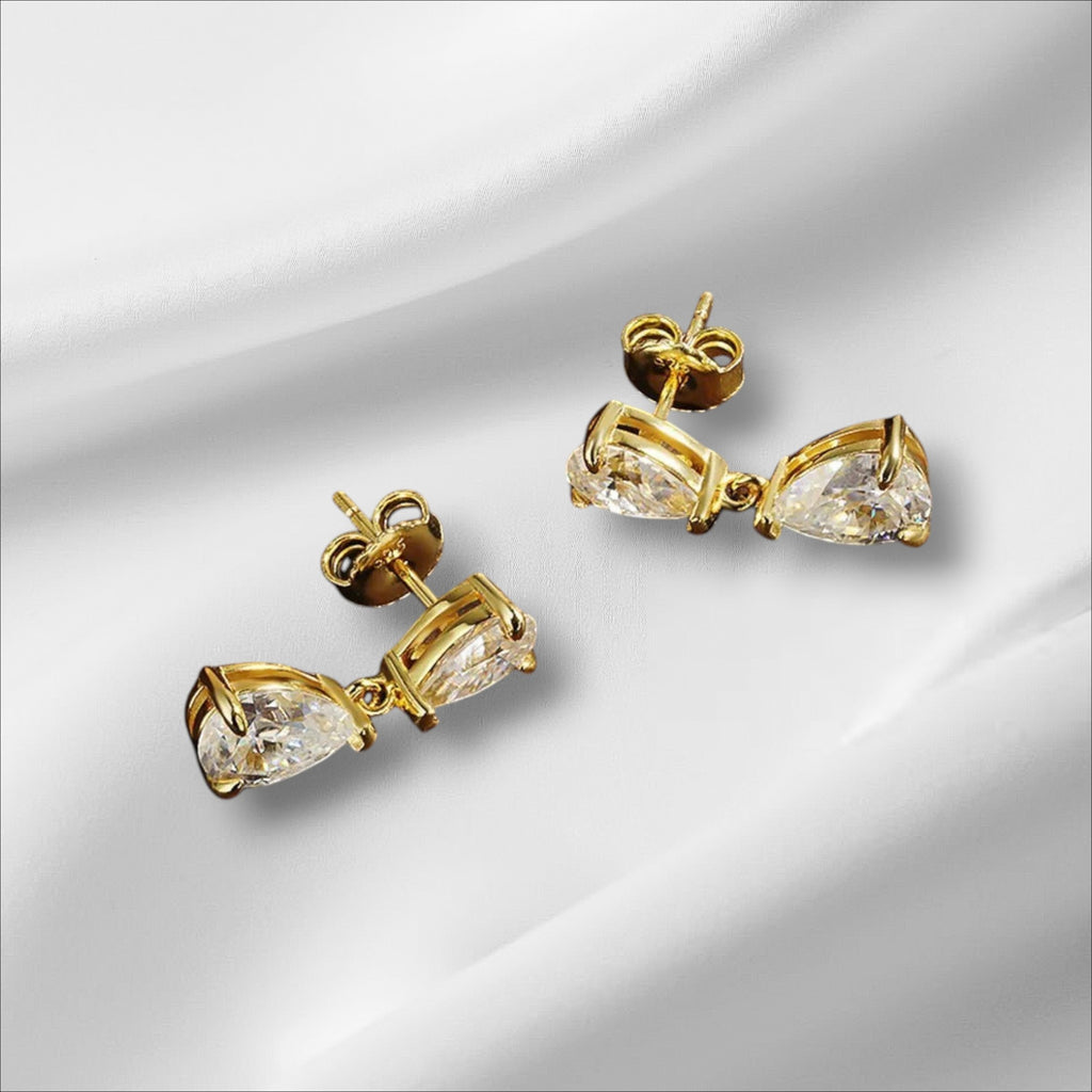 Bee-Bees D VVS1 pear cut moissanite drop earrings in 18k gold plated sterling silver with secure stud backing.