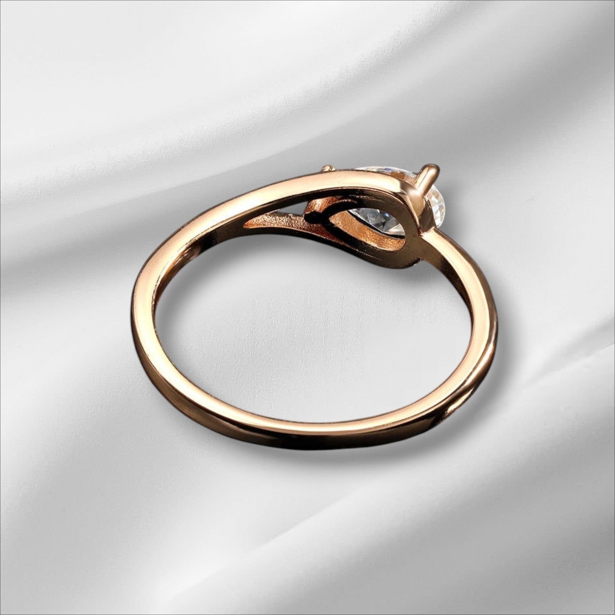 Bee-Bees 1ct pear cut moissanite engagement ring in rose gold plated sterling silver with GRA certification.
