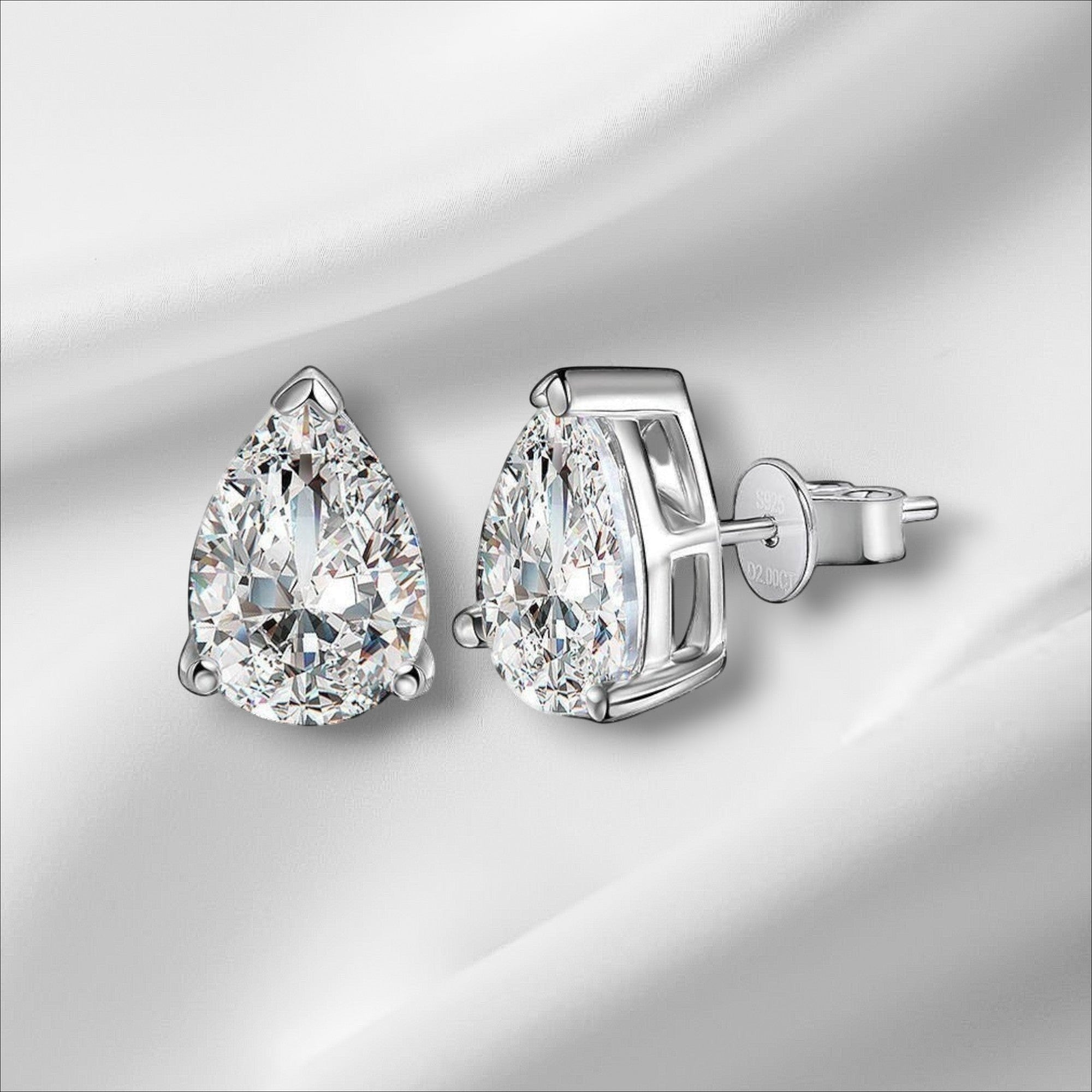 Bee-Bees D Color VVS1 Pear Moissanite Stud Earrings in 925 Sterling Silver with gold finish.