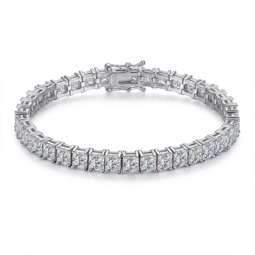 Bee-Bees Princess cut moissanite tennis bracelet in 925 silver with 18k white gold plating. Features VVS1 D color stones and a secure clasp.