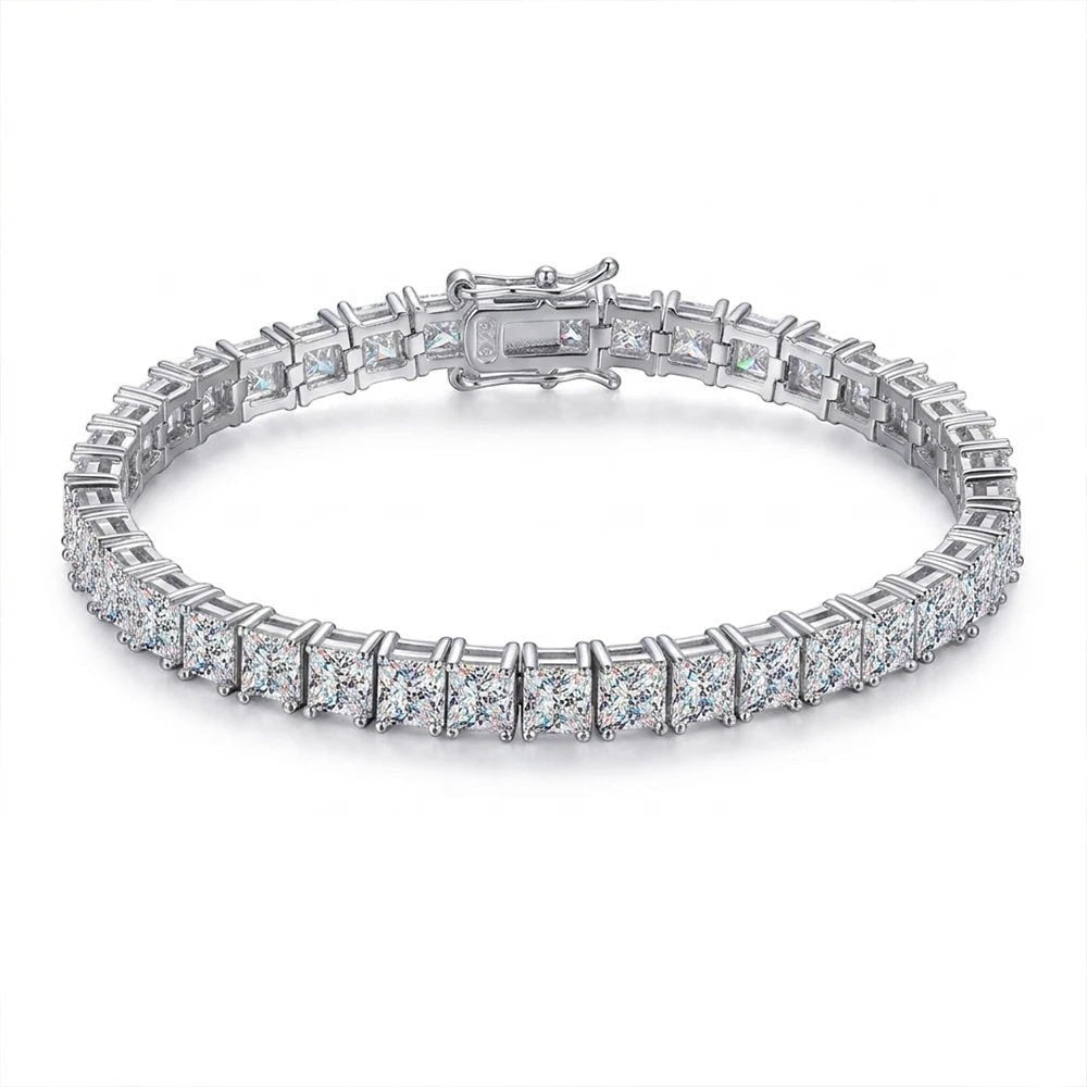 Bee-Bees Princess cut moissanite tennis bracelet in 925 silver with 18k white gold plating. Features VVS1 D color stones and a secure clasp.