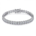 Bee-Bees princess cut moissanite tennis bracelet in 925 silver with 18k white gold plating. Features VVS1 D color stones and a secure clasp.