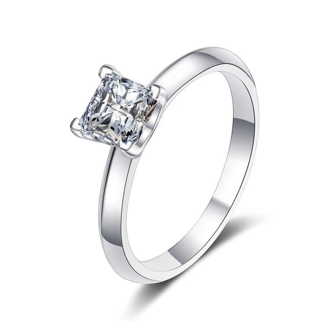 Bee-Bees Princess cut moissanite solitaire ring in sterling silver with 18K white gold plating. Features a D VVS1 stone.