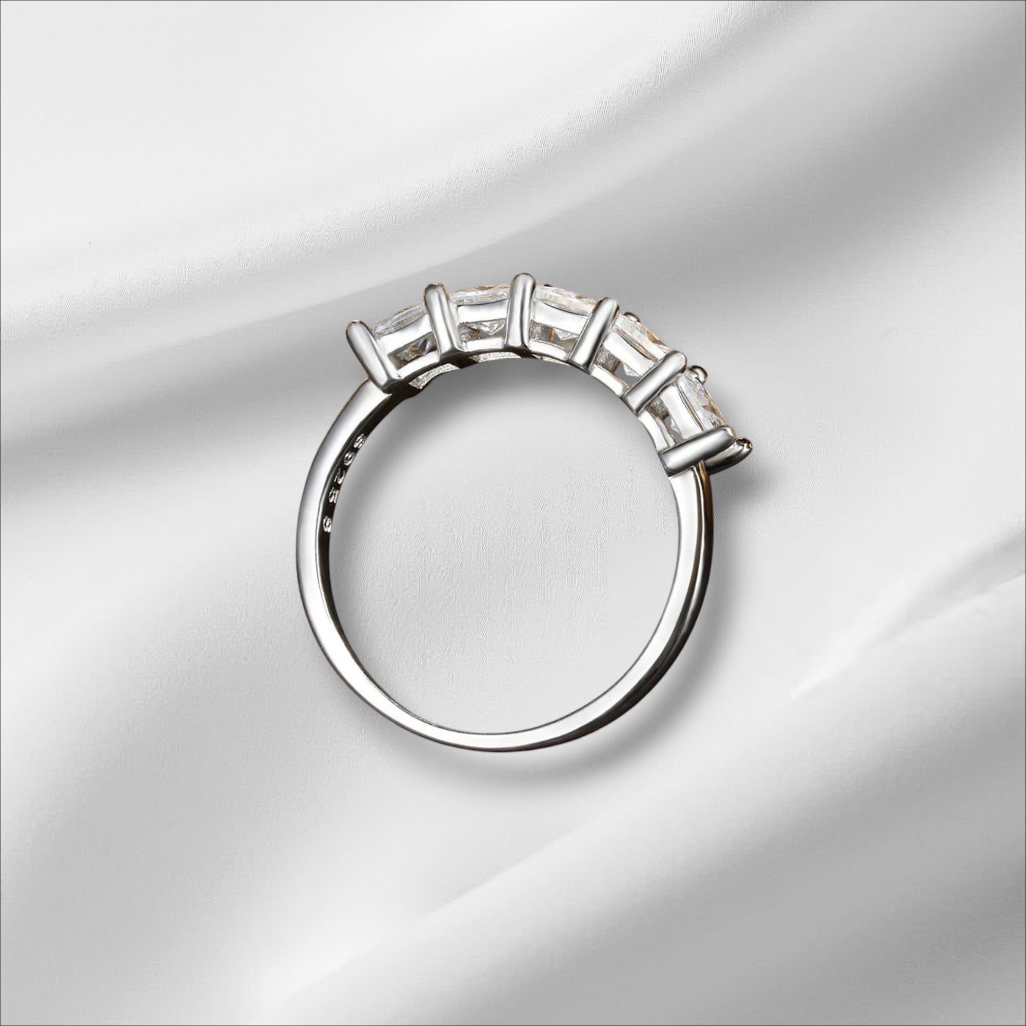 Bee-Bees 18k gold-plated sterling silver band with five princess-cut moissanite stones in a bezel setting.