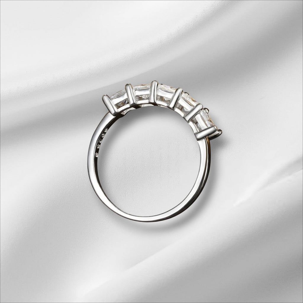 Bee-Bees 18k gold-plated sterling silver band with five princess-cut moissanite stones in a bezel setting.