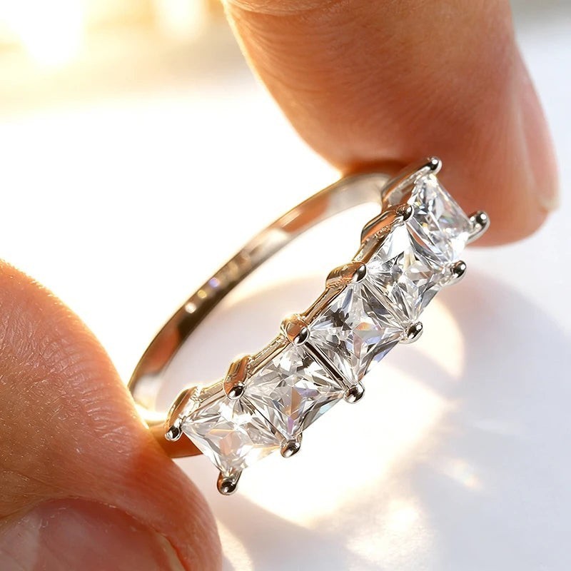 Bee-Bees Princess cut moissanite wedding band in 18k gold-plated sterling silver with five square stones.