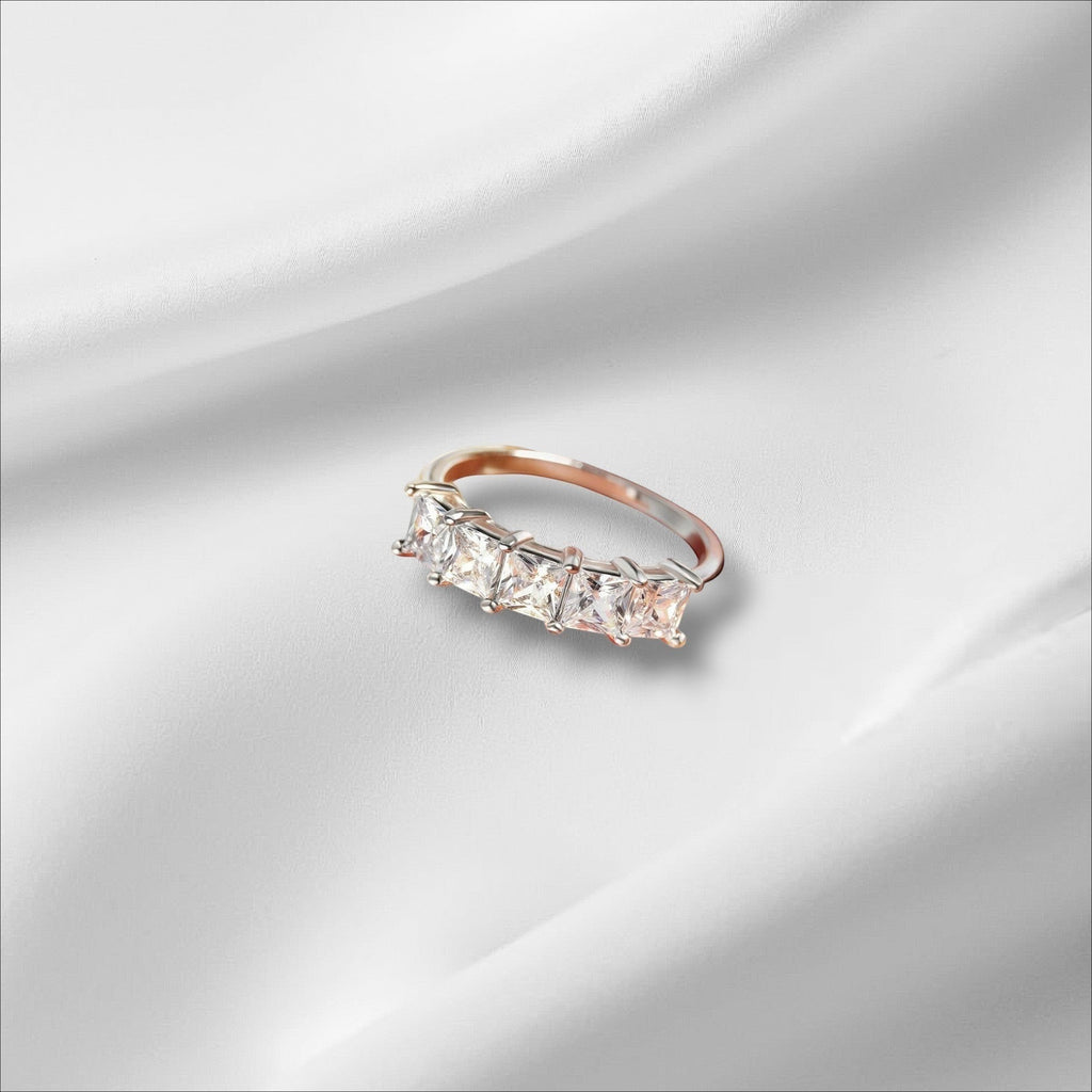 Bee-Bees 18k gold-plated sterling silver wedding band with five princess-cut moissanite stones.