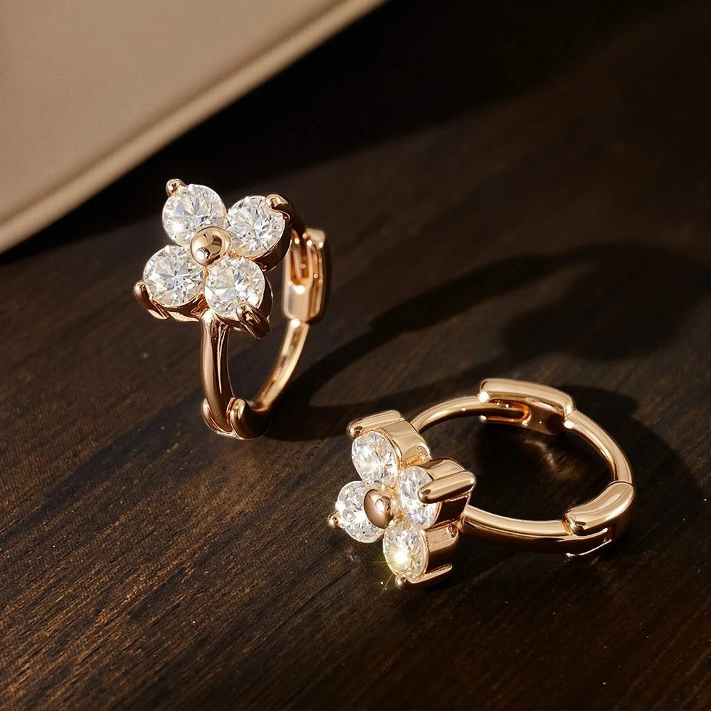 Bee-Bee's rose gold sterling silver hoop earrings with 3mm moissanite stones in a flower design.