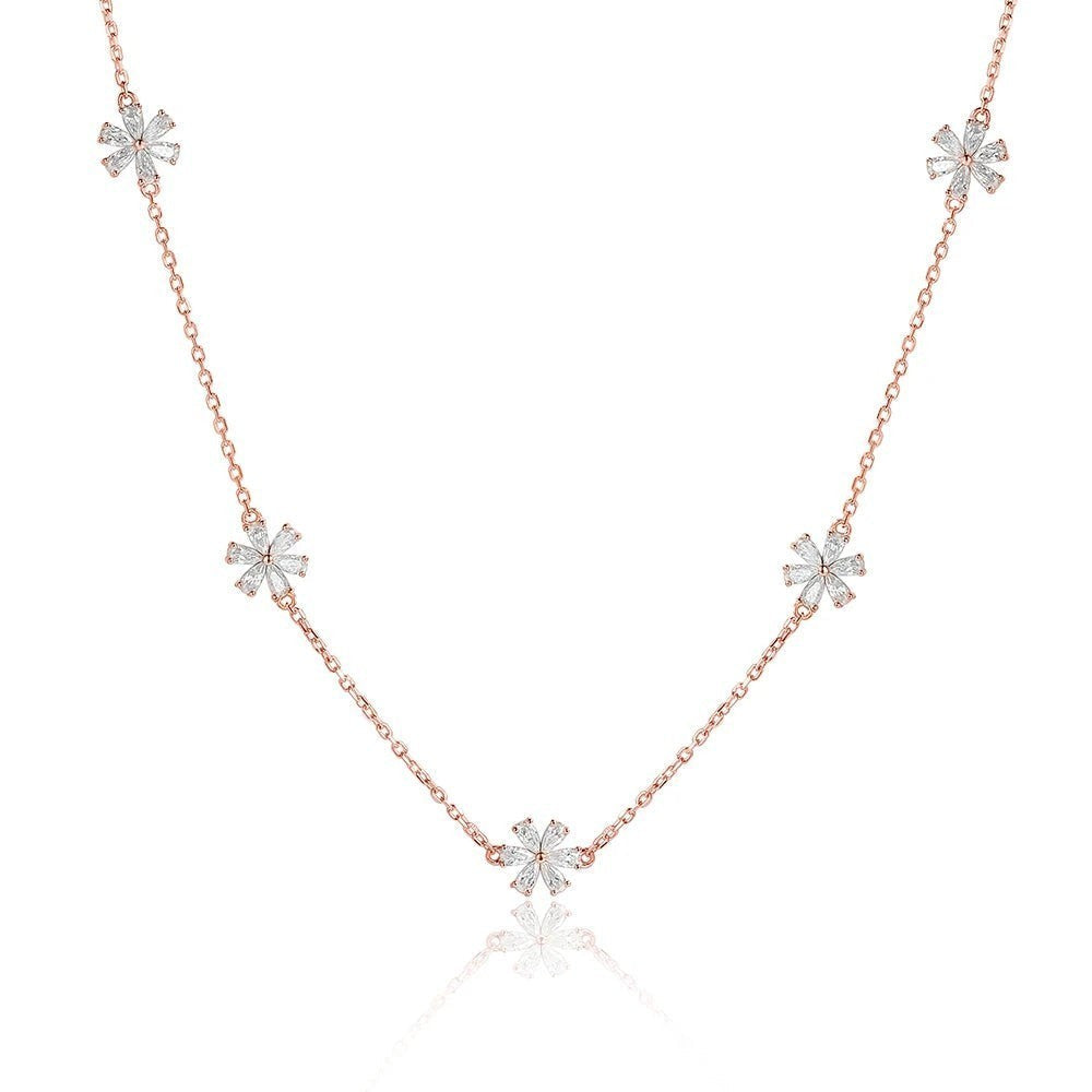 Bee-Bee's rose gold sterling silver necklace with five small flower charms, each with clear cubic zirconia.