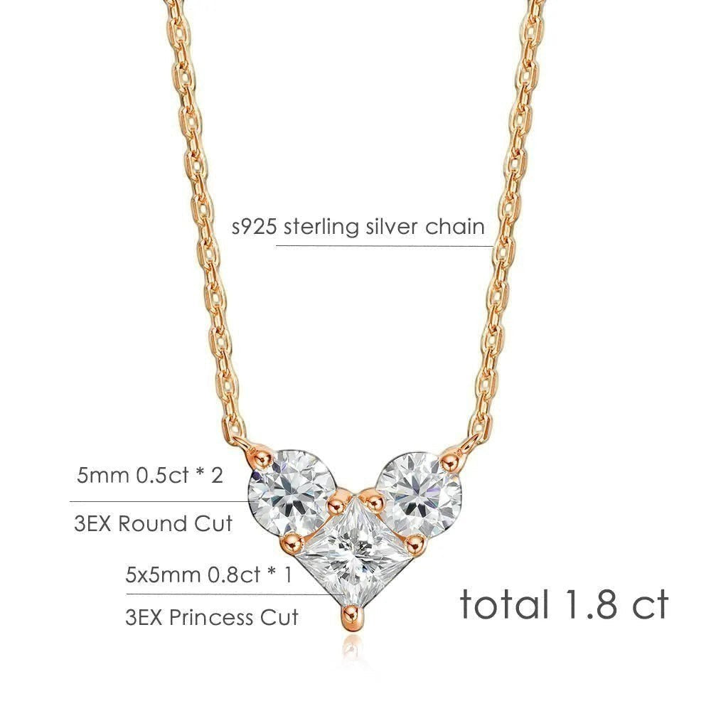 Bee-Bees rose gold plated sterling silver necklace with a heart-shaped cluster of three brilliant-cut moissanite stones, one princess-cut center stone and two round-cut side stones.