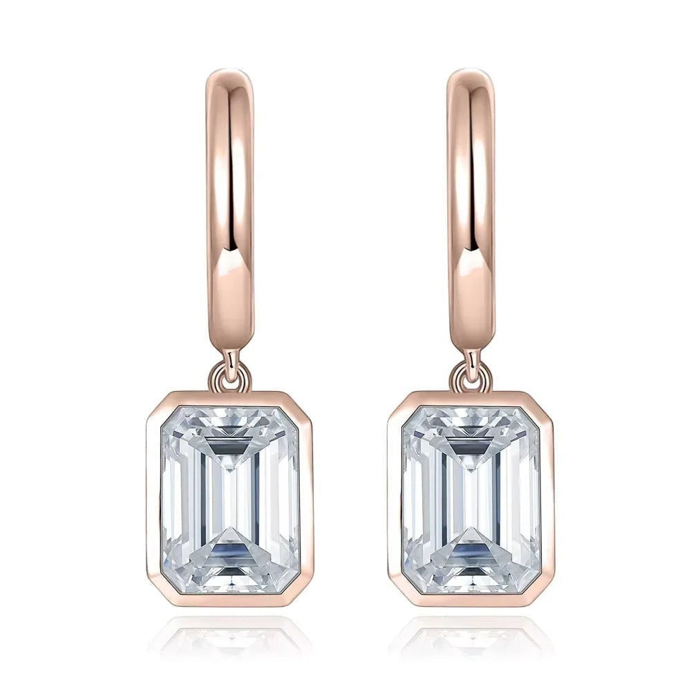 Bee-Bees rose gold plated sterling silver hoop drop earrings with D color emerald cut moissanite stones.