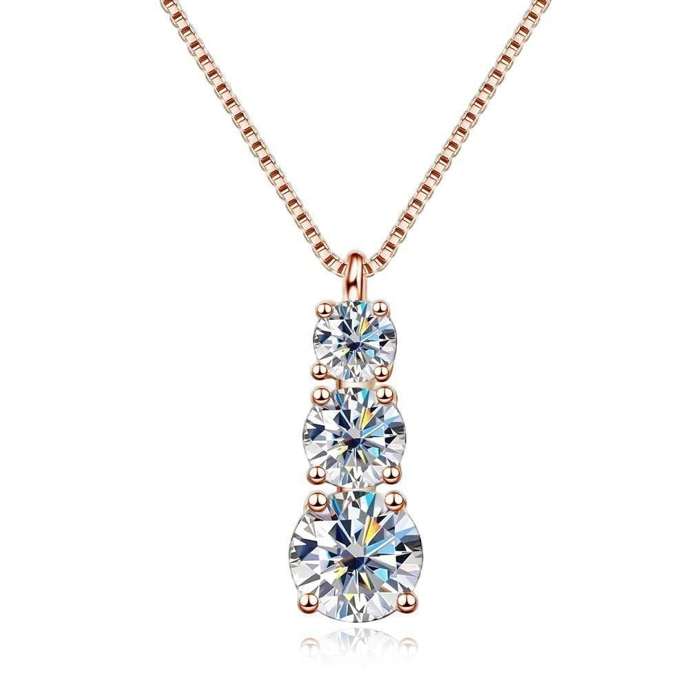 Bee-Bees rose gold plated sterling silver necklace with three round brilliant cut moissanite stones in graduating sizes.