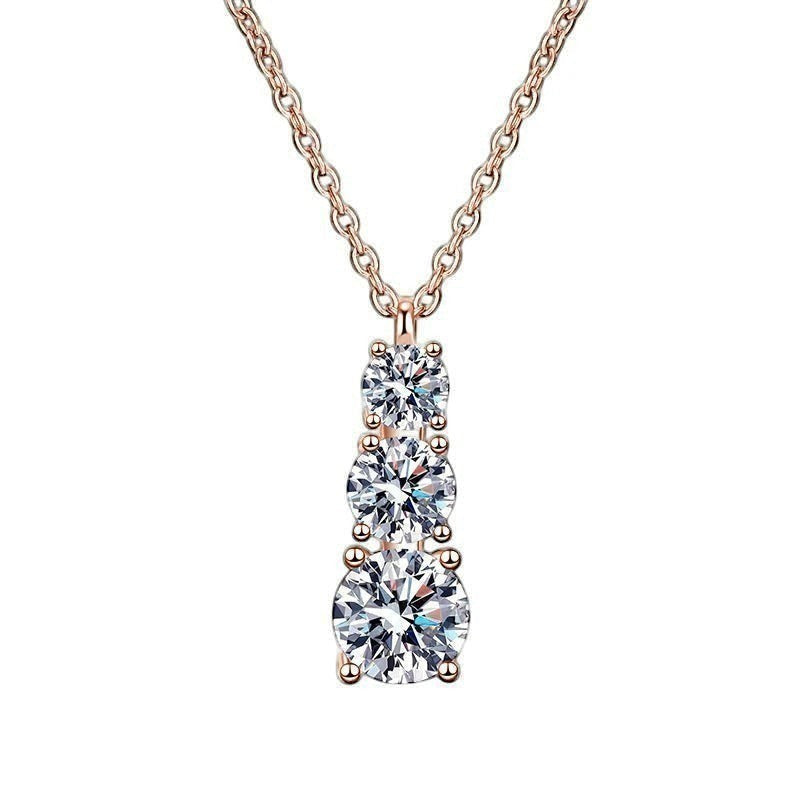 Bee-Bees rose gold plated sterling silver necklace with three round brilliant cut moissanite stones in graduated sizes.