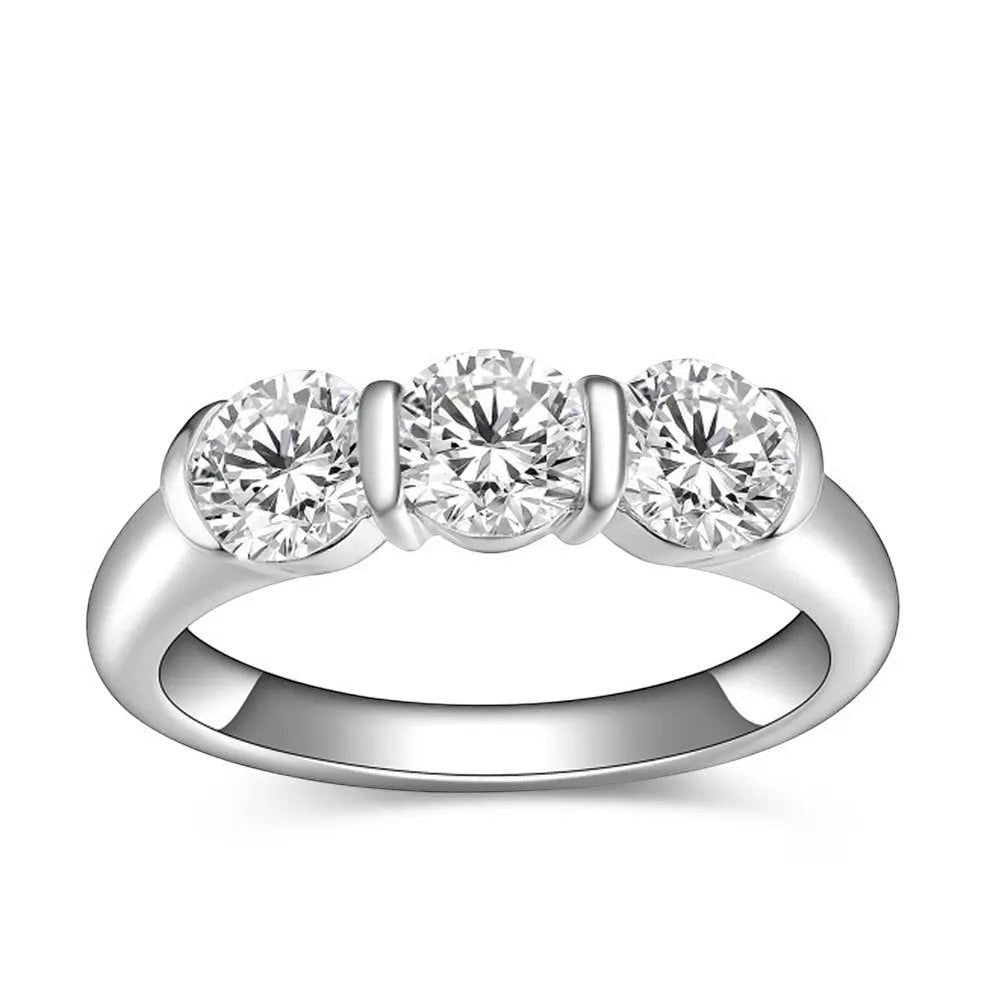 Bee-Bees three round moissanite stones set in a 925 sterling silver band with 18k white gold plating.