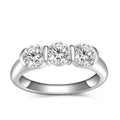 Bee-Bees three round moissanite stones set in a 925 sterling silver band with 18k white gold plating.