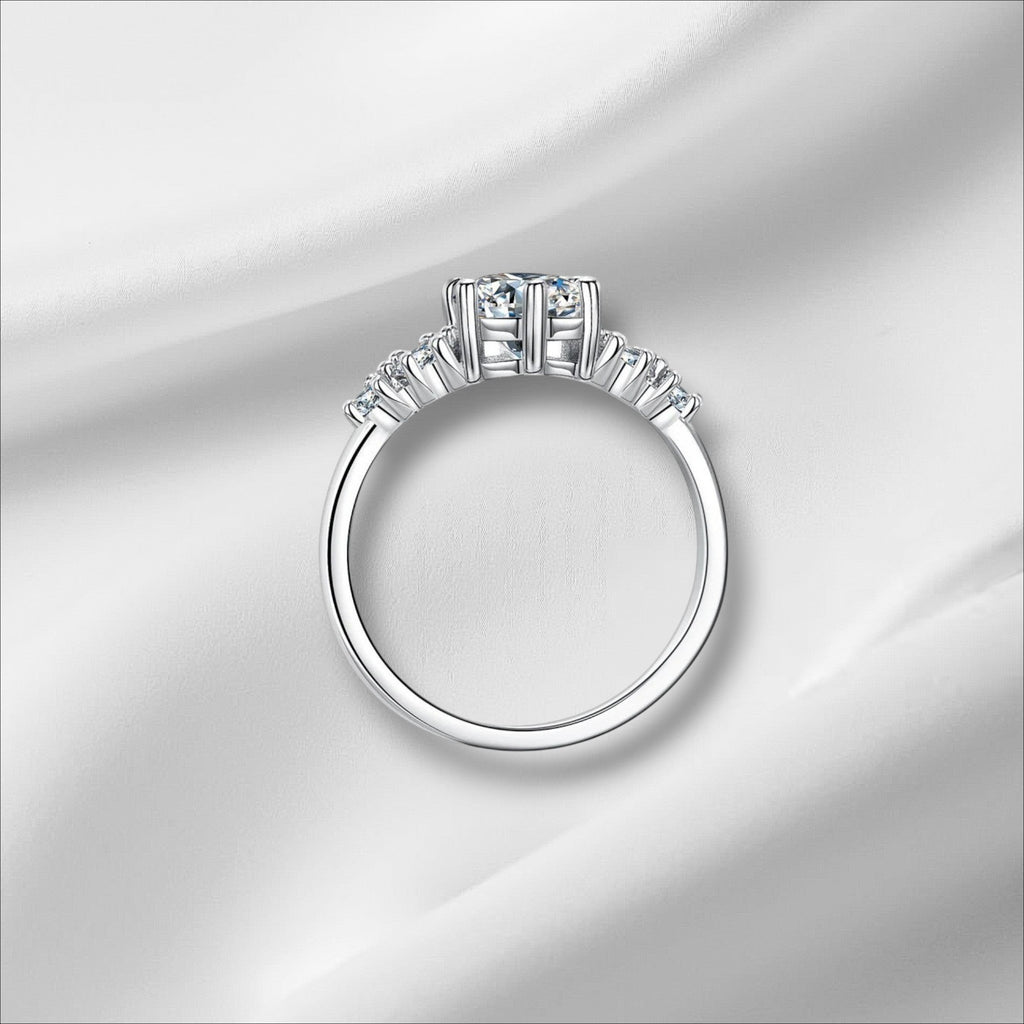 Bee-Bees 1ct round moissanite engagement ring in sterling silver with 18k white gold plating and GRA certification.