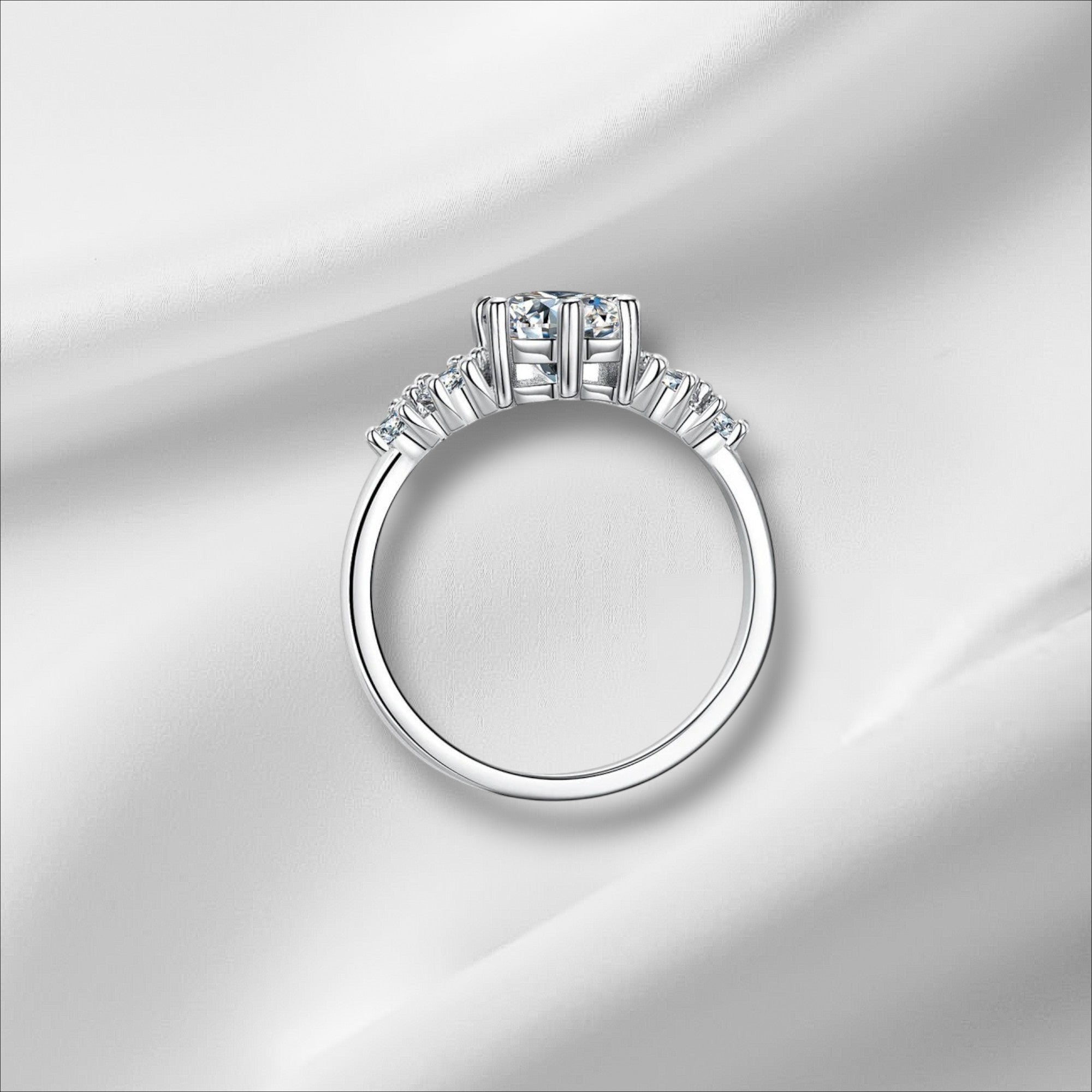 Bee-Bees 1ct round moissanite engagement ring in sterling silver with 18k white gold plating and GRA certification.