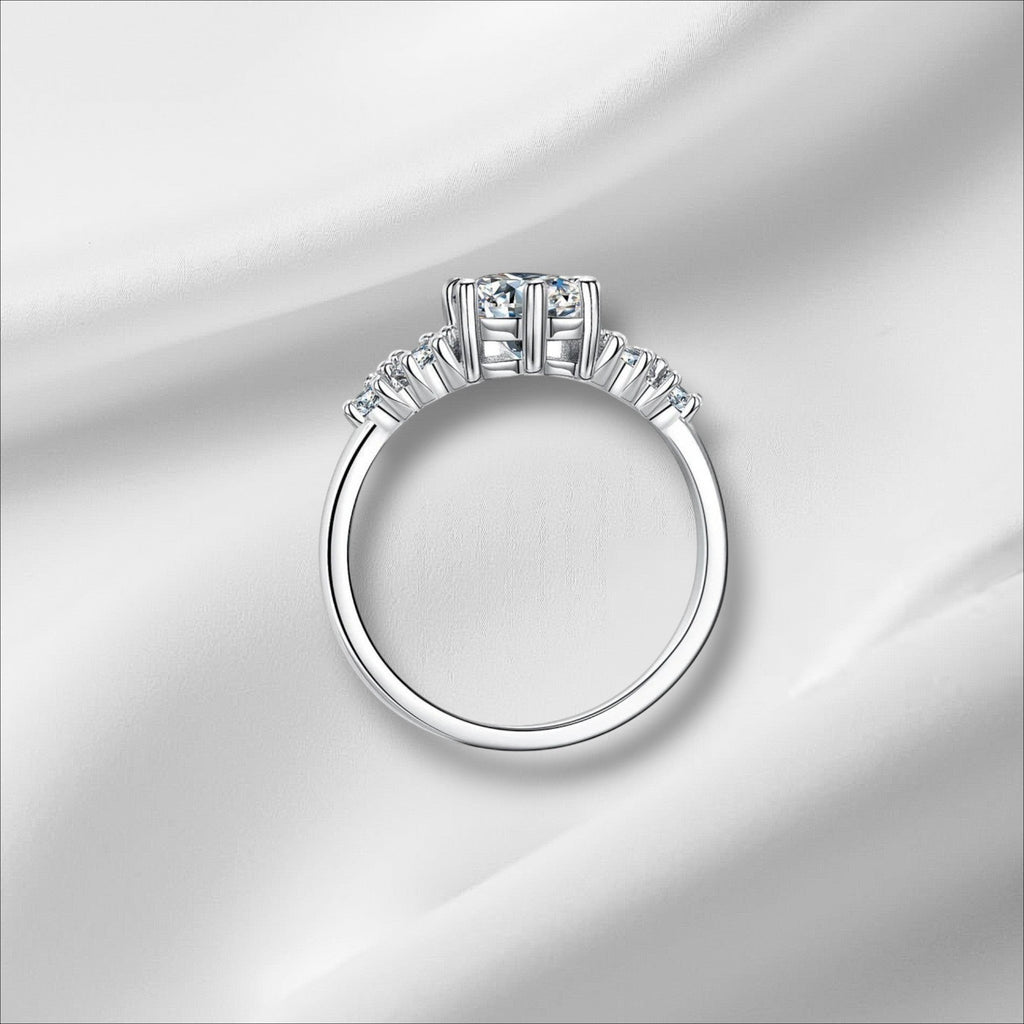 Bee-Bees 1ct round moissanite engagement ring in sterling silver with 18k white gold plating and GRA certification.