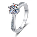 Bee-Bee's sterling silver engagement ring with a round D VVS1 moissanite center stone and pavé accents on the band.