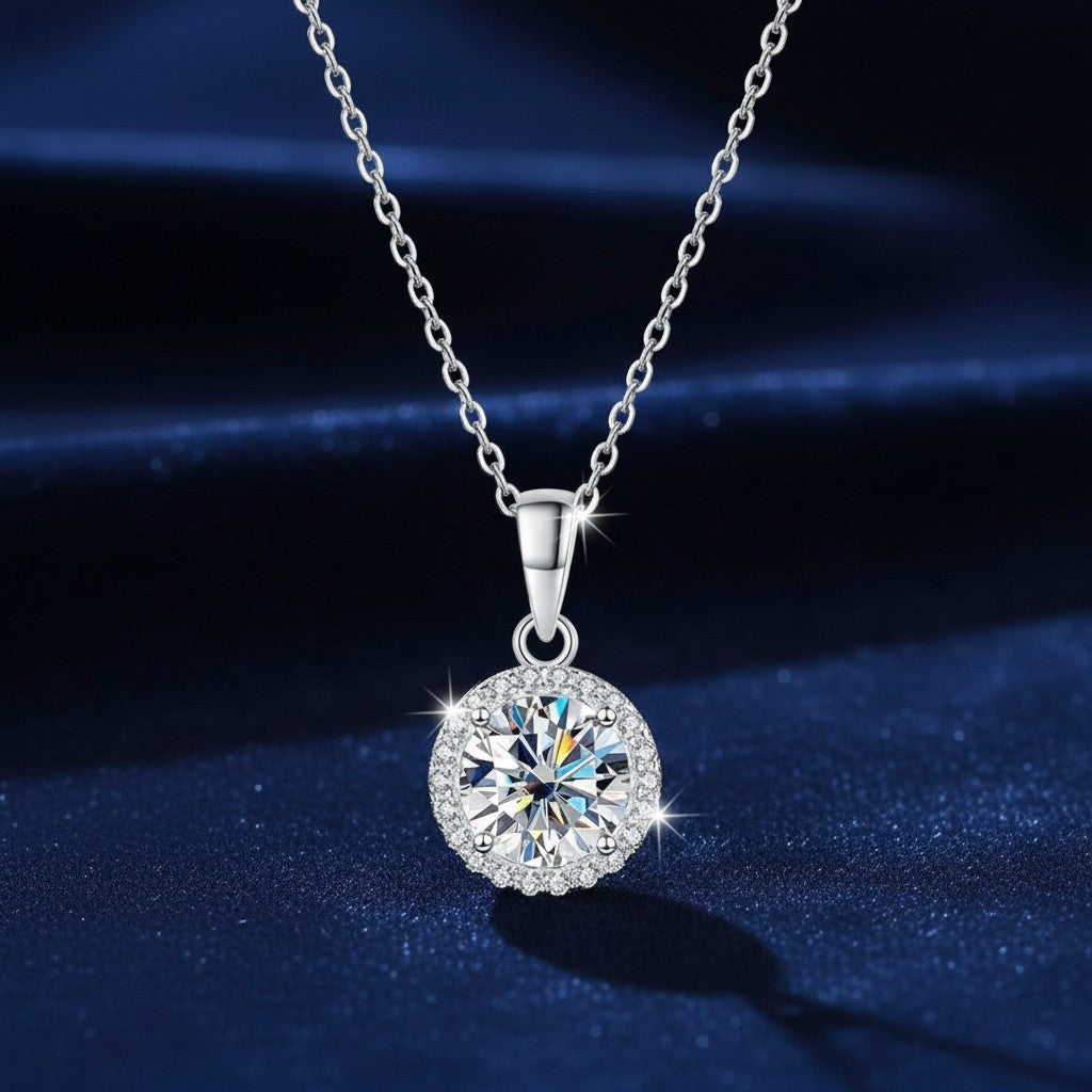 Bee-Bees 1ct round moissanite halo necklace in 925 sterling silver with 18k white gold plating. D color, VVS1 clarity.