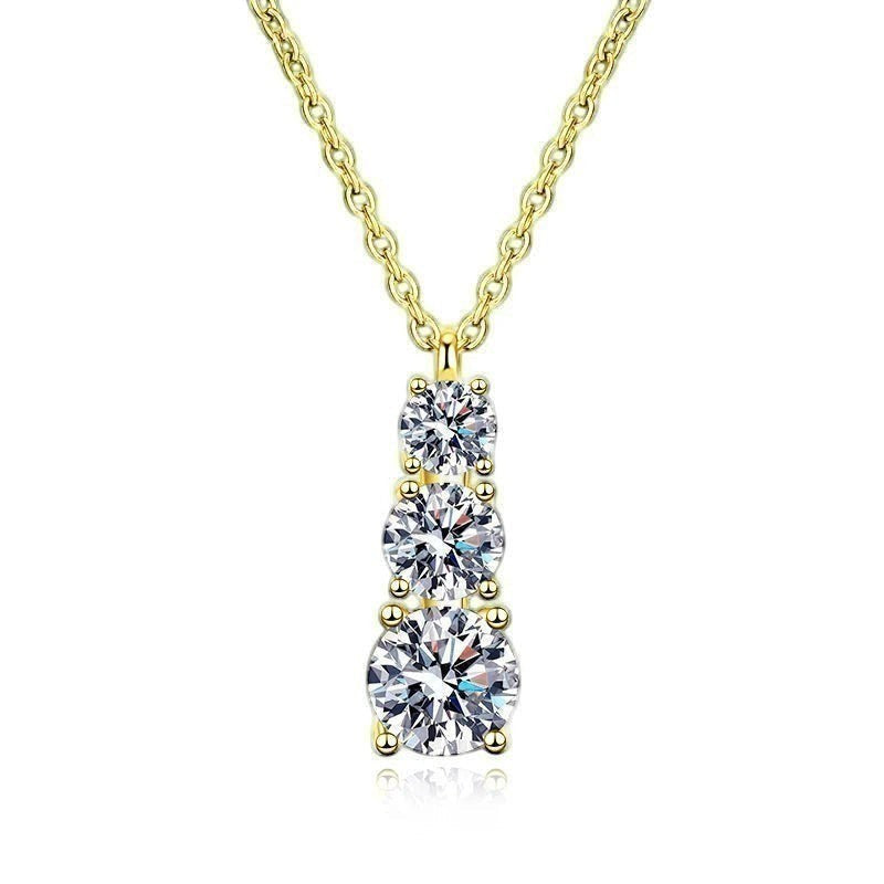 Bee-Bees yellow gold plated sterling silver necklace with three round brilliant cut moissanite stones in graduated sizes.